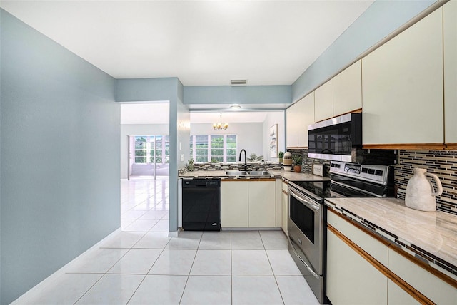 4270 Boston Cir, New Port Richey, FL 34653 - kitchen featuring stainless steel appliances, a sink, decorative backsplash, a chandelier, and light tile patterned floors