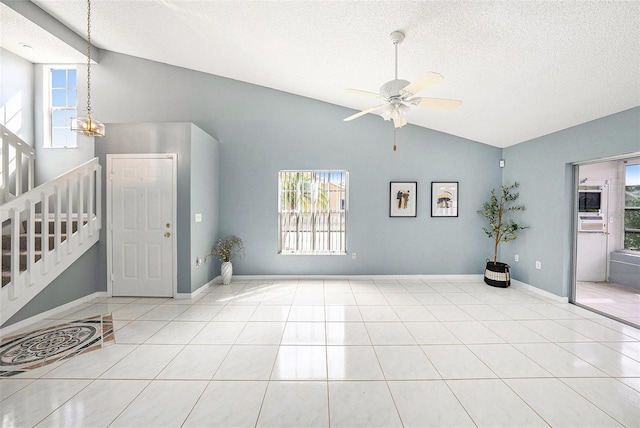 4270 Boston Cir, New Port Richey, FL 34653 - foyer entrance with lofted ceiling, plenty of natural light, a textured ceiling, tile patterned flooring, and ceiling fan