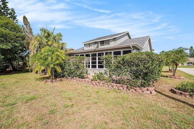 4270 Boston Cir, New Port Richey, FL 34653 - rear view of house featuring a yard and stucco siding