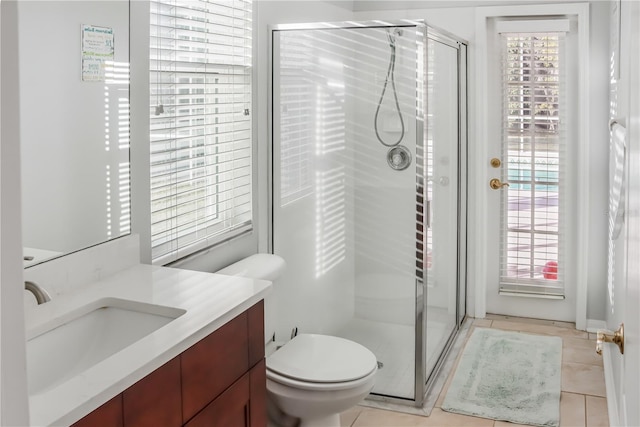7533 Dunbridge Dr, Odessa, FL 33556 - full bath with a shower stall, vanity, tile patterned floors, and toilet