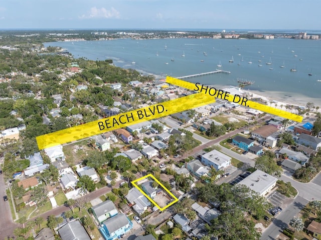 3031 56th St S, Gulfport, FL 33707 - aerial view of property and surrounding area with property boundaries highlighted, a nearby body of water, and nearby suburban area
