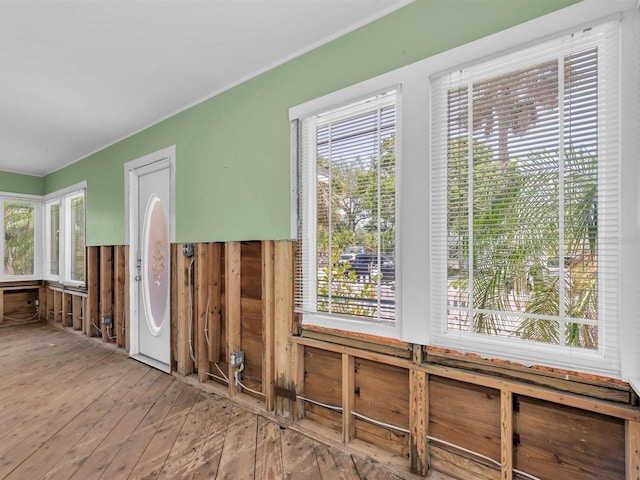 3031 56th St S, Gulfport, FL 33707 - unfurnished room with wood-type flooring and healthy amount of natural light