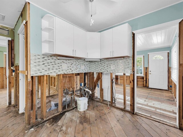 3031 56th St S, Gulfport, FL 33707 - kitchen featuring white cabinetry, light wood-style flooring, tasteful backsplash, open shelves, and ceiling fan