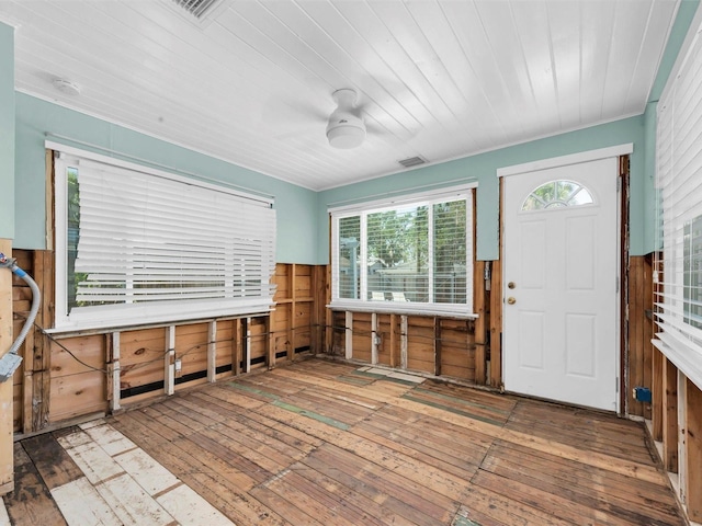 3031 56th St S, Gulfport, FL 33707 - entrance foyer featuring hardwood / wood-style flooring, a ceiling fan, wooden walls, a wainscoted wall, and wooden ceiling