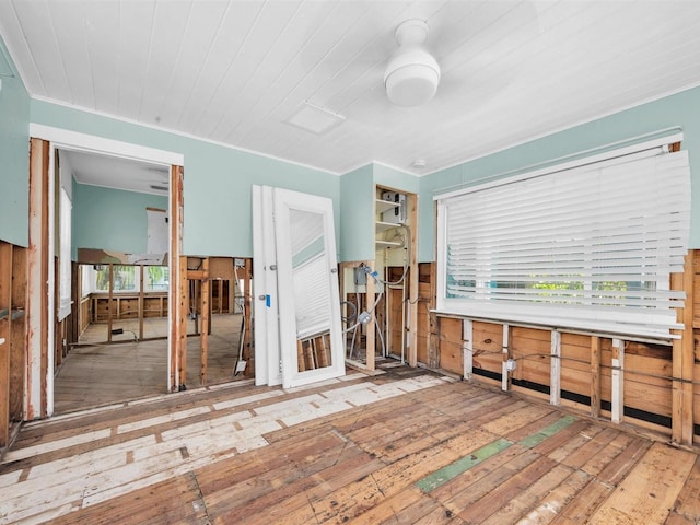 3031 56th St S, Gulfport, FL 33707 - unfurnished room featuring hardwood / wood-style flooring and crown molding