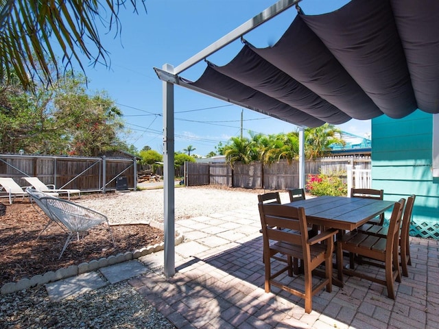 3031 56th St S, Gulfport, FL 33707 - view of patio / terrace featuring outdoor dining area and a fenced backyard