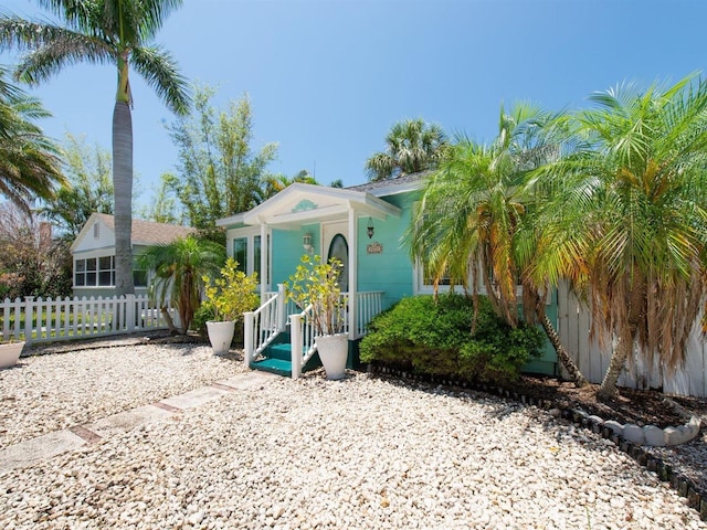 3031 56th St S, Gulfport, FL 33707 - view of front facade featuring fence and covered porch