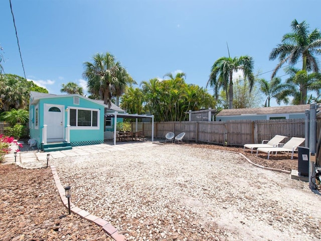 3031 56th St S, Gulfport, FL 33707 - fenced backyard featuring a patio area