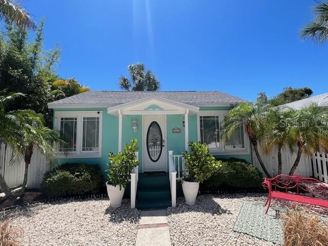 3031 56th St S, Gulfport, FL 33707 - view of front facade featuring fence and roof with shingles