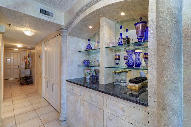 2504 Gulf Blvd Unit 201, Indian Rocks Beach, FL 33785 - indoor dry bar with a textured ceiling, light tile patterned floors, and a textured wall