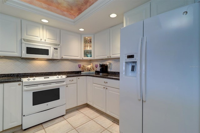 2504 Gulf Blvd Unit 201, Indian Rocks Beach, FL 33785 - kitchen with white appliances, recessed lighting, a raised ceiling, white cabinetry, and ornamental molding