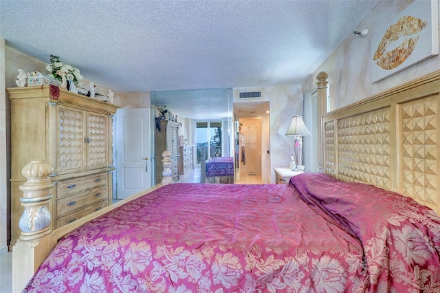 2504 Gulf Blvd Unit 201, Indian Rocks Beach, FL 33785 - bedroom featuring a textured ceiling