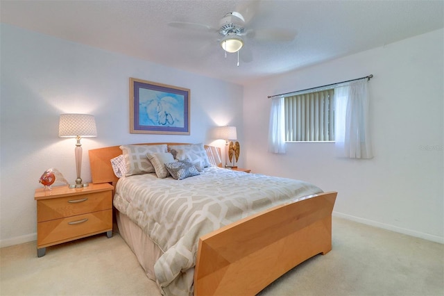 2504 Gulf Blvd Unit 201, Indian Rocks Beach, FL 33785 - bedroom featuring light carpet, baseboards, and a ceiling fan