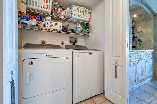 2504 Gulf Blvd Unit 201, Indian Rocks Beach, FL 33785 - laundry room with independent washer and dryer and light tile patterned floors