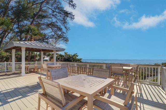 2504 Gulf Blvd Unit 201, Indian Rocks Beach, FL 33785 - deck featuring outdoor dining area, a water view, and a gazebo