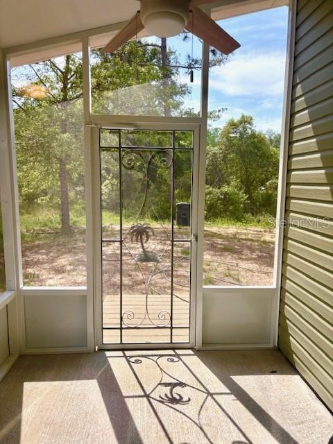 6952 W Barbara Ann Ln, Homosassa, FL 34446 - unfurnished sunroom with ceiling fan