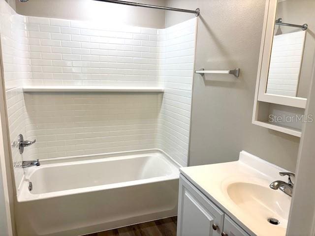 6952 W Barbara Ann Ln, Homosassa, FL 34446 - full bathroom with shower / washtub combination, vanity, and wood finished floors