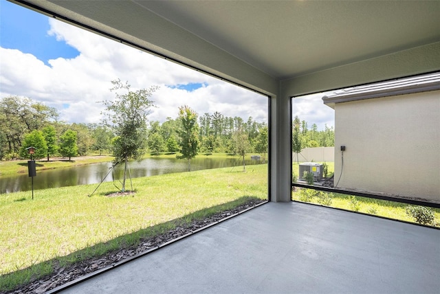 10098 Banyan Breeze Blvd, Land O Lakes, FL 34638 - unfurnished sunroom featuring a water view and view of scattered trees
