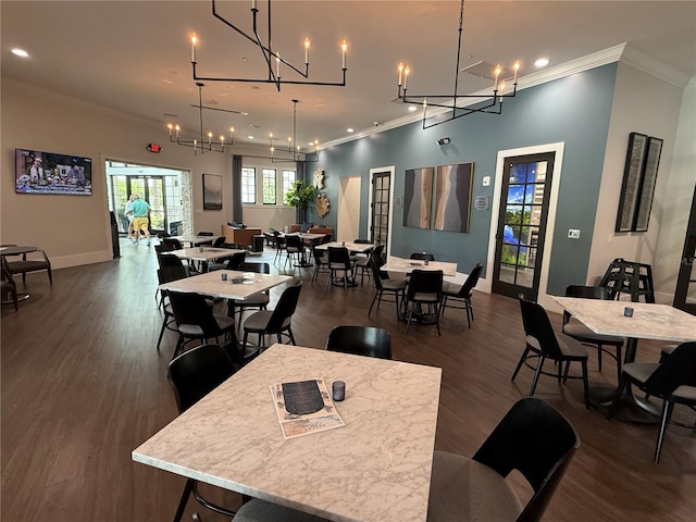 10098 Banyan Breeze Blvd, Land O Lakes, FL 34638 - dining room featuring crown molding, dark wood-type flooring, baseboards, recessed lighting, and a chandelier
