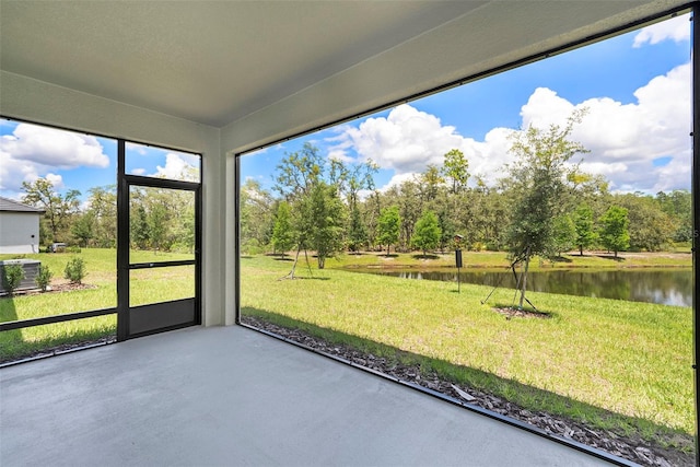 10098 Banyan Breeze Blvd, Land O Lakes, FL 34638 - unfurnished sunroom featuring a water view and view of scattered trees