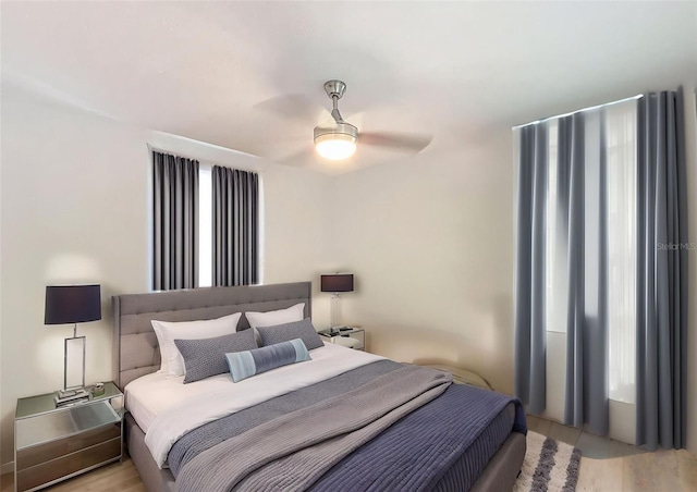 1221 E Hamilton Ave, Tampa, FL 33604 - bedroom featuring a ceiling fan and light wood finished floors
