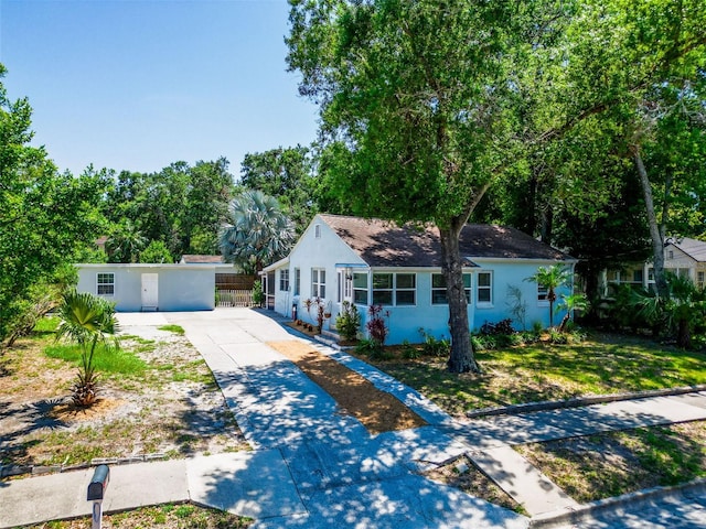 1221 E Hamilton Ave, Tampa, FL 33604 - view of front of home with concrete driveway and stucco siding