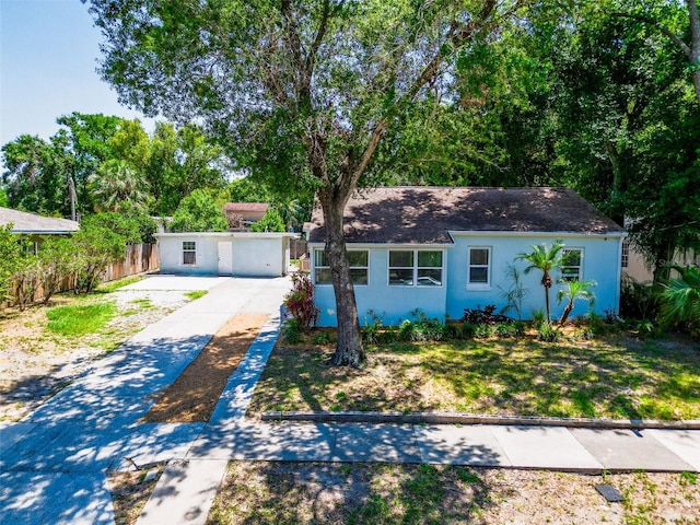 1221 E Hamilton Ave, Tampa, FL 33604 - ranch-style home with stucco siding, driveway, and roof with shingles