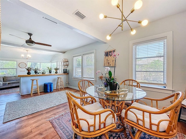 1221 E Hamilton Ave, Tampa, FL 33604 - dining area featuring a chandelier, wood finished floors, ceiling fan, and baseboards