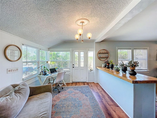 1221 E Hamilton Ave, Tampa, FL 33604 - home office with a textured ceiling, wood finished floors, lofted ceiling, and a chandelier