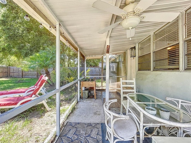 1221 E Hamilton Ave, Tampa, FL 33604 - unfurnished sunroom featuring ceiling fan