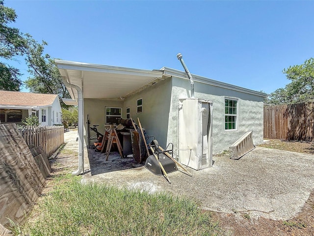 1221 E Hamilton Ave, Tampa, FL 33604 - back of house with stucco siding and a patio