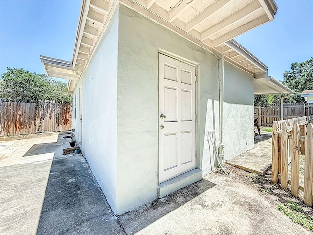 1221 E Hamilton Ave, Tampa, FL 33604 - doorway to property featuring stucco siding