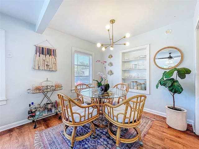 1221 E Hamilton Ave, Tampa, FL 33604 - dining space with a chandelier, wood finished floors, baseboards, beam ceiling, and built in features
