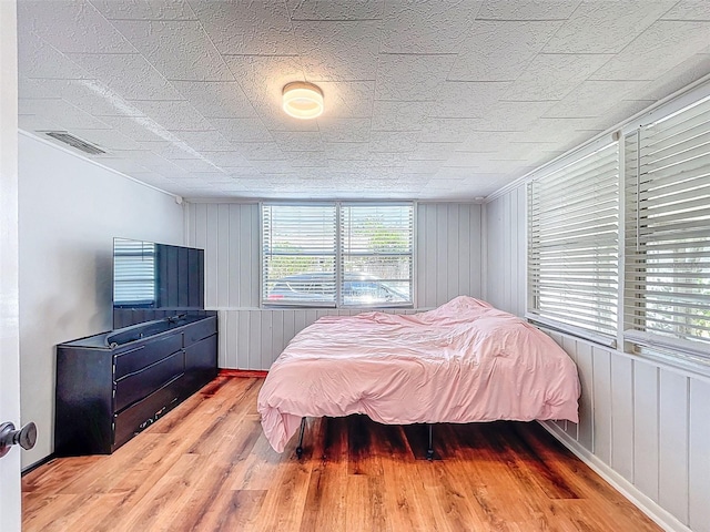 1221 E Hamilton Ave, Tampa, FL 33604 - bedroom with wood finished floors and baseboards