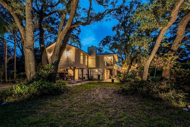 420 Hanby St, Crystal Beach, FL 34681 - back of house with a chimney and stairway