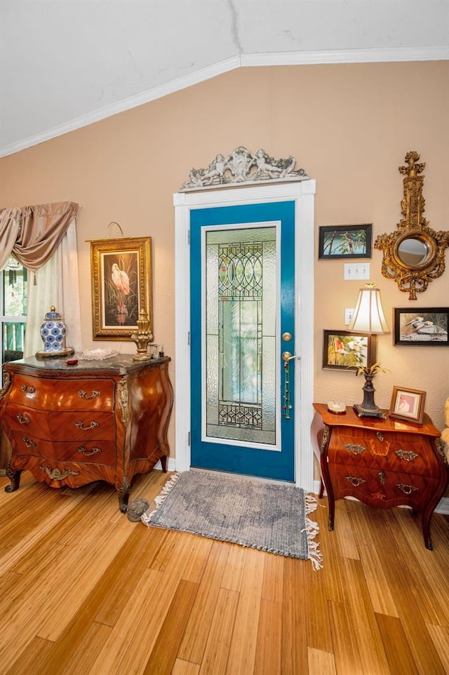 420 Hanby St, Crystal Beach, FL 34681 - entrance foyer featuring ornamental molding, light wood-style floors, and lofted ceiling