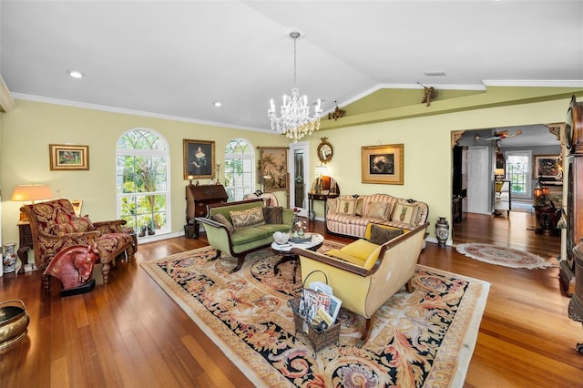 420 Hanby St, Crystal Beach, FL 34681 - living area featuring wood finished floors, a chandelier, vaulted ceiling, and ornamental molding