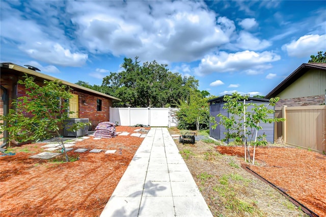 2524 Laurelwood Ln, Valrico, FL 33596 - view of yard with fence, a shed, an outbuilding, and central AC unit