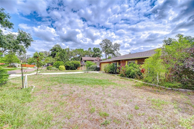 2524 Laurelwood Ln, Valrico, FL 33596 - view of grassy yard with a garage and concrete driveway