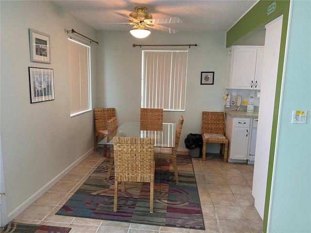 8055 112th St Unit 406, Seminole, FL 33772 - dining space with light tile patterned floors, ceiling fan, and baseboards