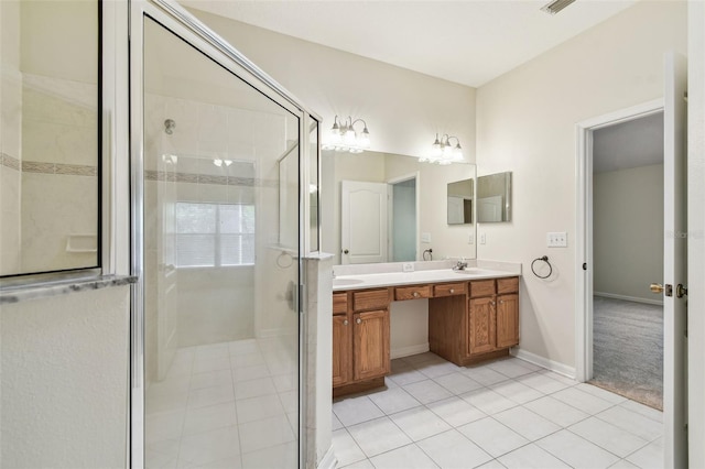 bathroom featuring tile patterned flooring, double vanity, and a stall shower