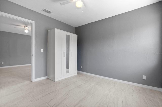 11009 Spivey Rd Unit 1, Gibsonton, FL 33534 - unfurnished bedroom featuring a ceiling fan and baseboards