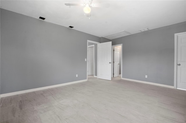 11009 Spivey Rd Unit 1, Gibsonton, FL 33534 - unfurnished room with ceiling fan, attic access, and baseboards