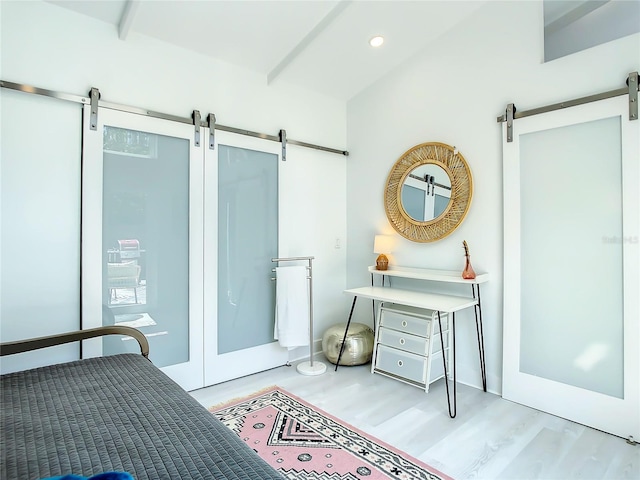 5111 28th Ave N, Saint Petersburg, FL 33710 - bedroom with a barn door, wood finished floors, recessed lighting, and beamed ceiling