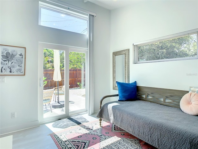 5111 28th Ave N, Saint Petersburg, FL 33710 - bedroom with access to exterior, baseboards, and a high ceiling