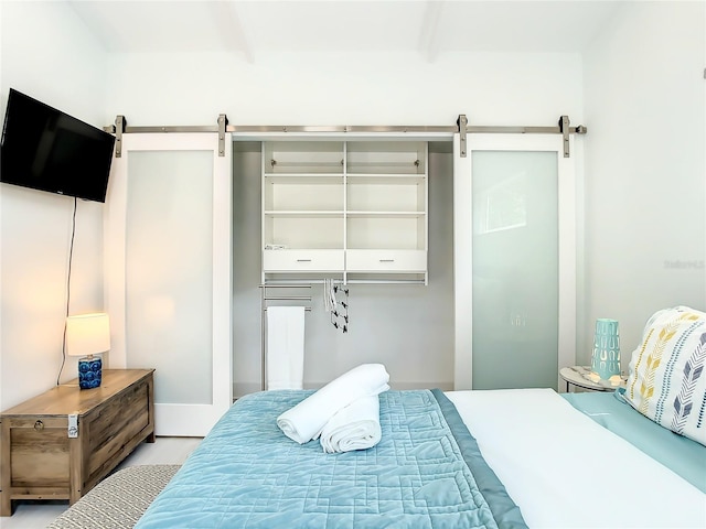 5111 28th Ave N, Saint Petersburg, FL 33710 - bedroom with a barn door and beam ceiling