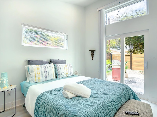 5111 28th Ave N, Saint Petersburg, FL 33710 - bedroom featuring access to exterior and baseboards