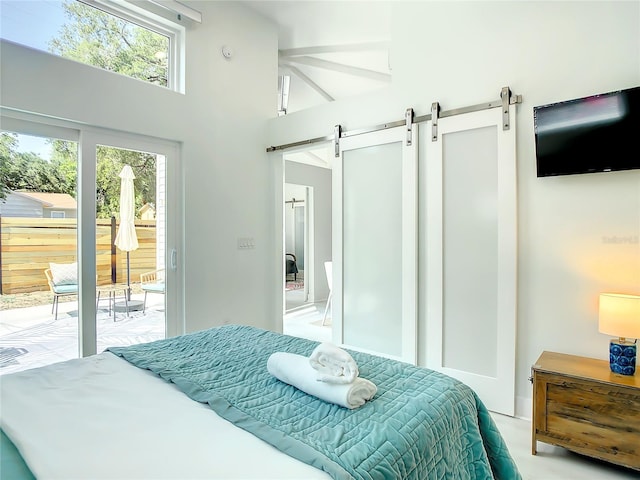 5111 28th Ave N, Saint Petersburg, FL 33710 - bedroom with a barn door, access to outside, and a towering ceiling