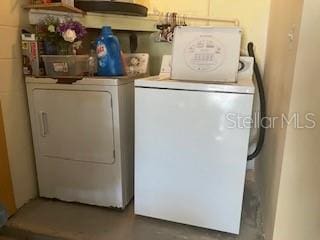 washroom with washing machine and dryer