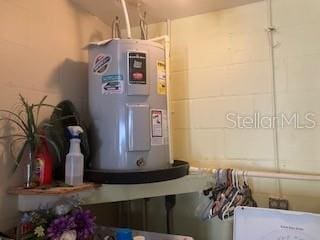 utility room with water heater